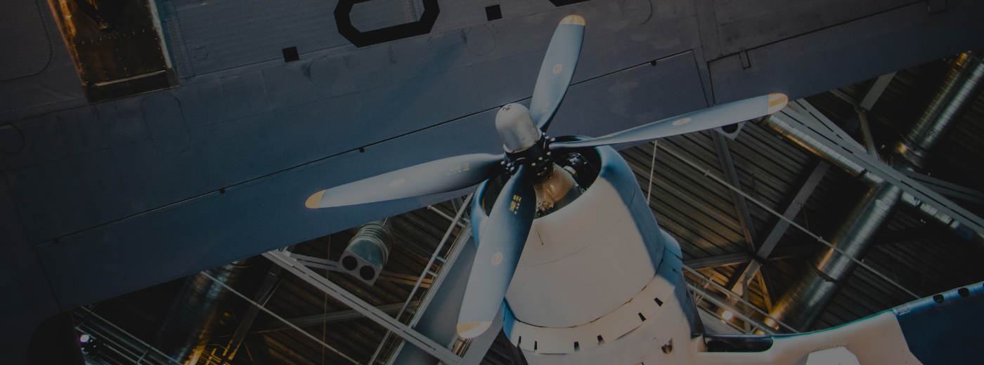 A large airplane with a prominent propeller mounted on its top, showcasing its design and engineering features