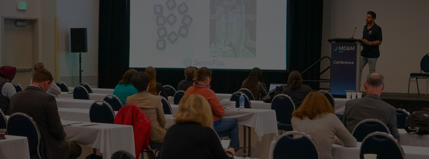 Speaker on the stage with Rear view of Audience in the conference hall or seminar meeting, business and education concept