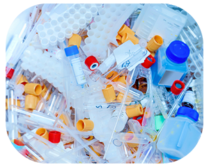 A disorganized pile of various plastic bottles and tubes stacked together photo