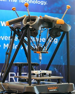 A display machine at a trade show, highlighting innovative features and drawing interest from visitors