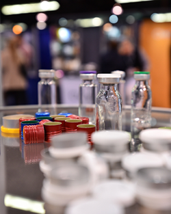 A table displaying various containers and bottles of different shapes and sizes